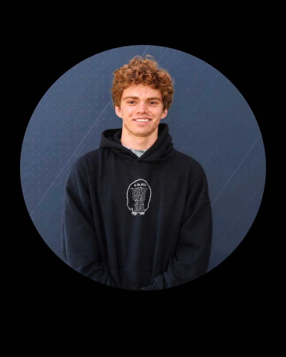 Me Swearengin smiling in a black hoodie